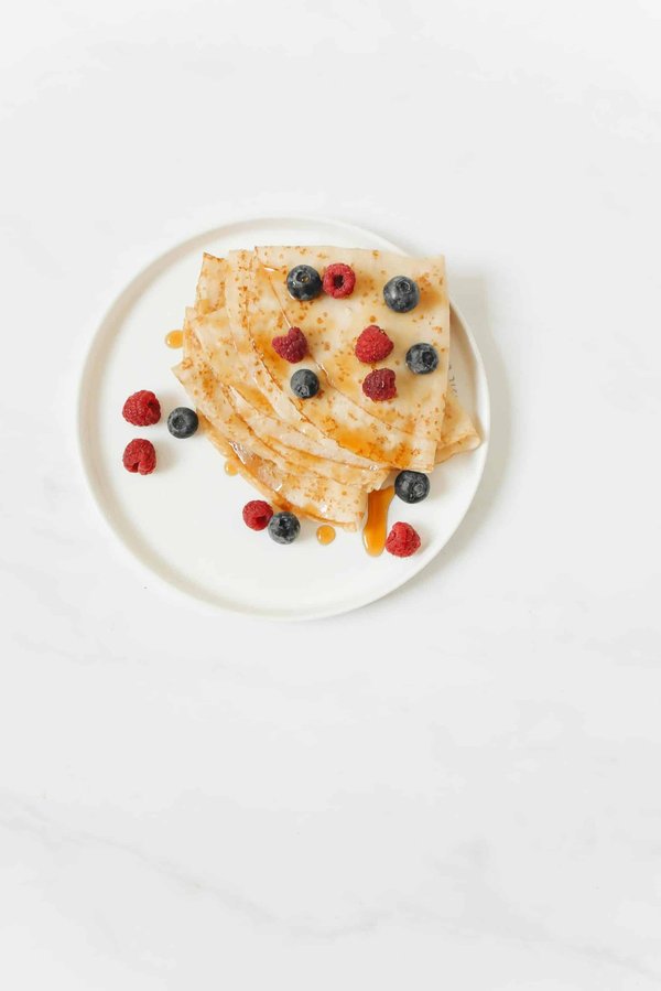 What Techniques Can Make a Perfectly Fluffy Ricotta Pancake with Blueberry Compote?